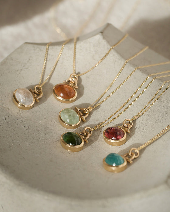 Collection of tourmaline gold necklaces by Natalie Vernazza, elegant jewellery