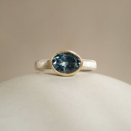 Oval london blue topaz mixed metal ring by Natalie Vernazza elegant jewellery
