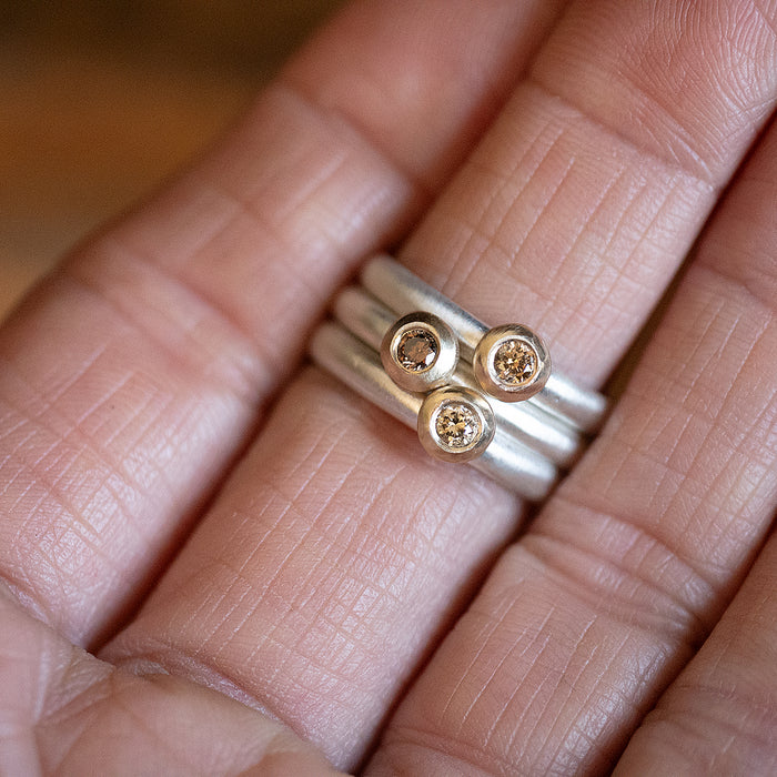 Contemporary warm diamond stacking rings by Natalie Vernazza elegant jewellery