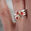 Mixed metal red sapphire stacking rings worn by Natalie Vernazza elegant jewellery.